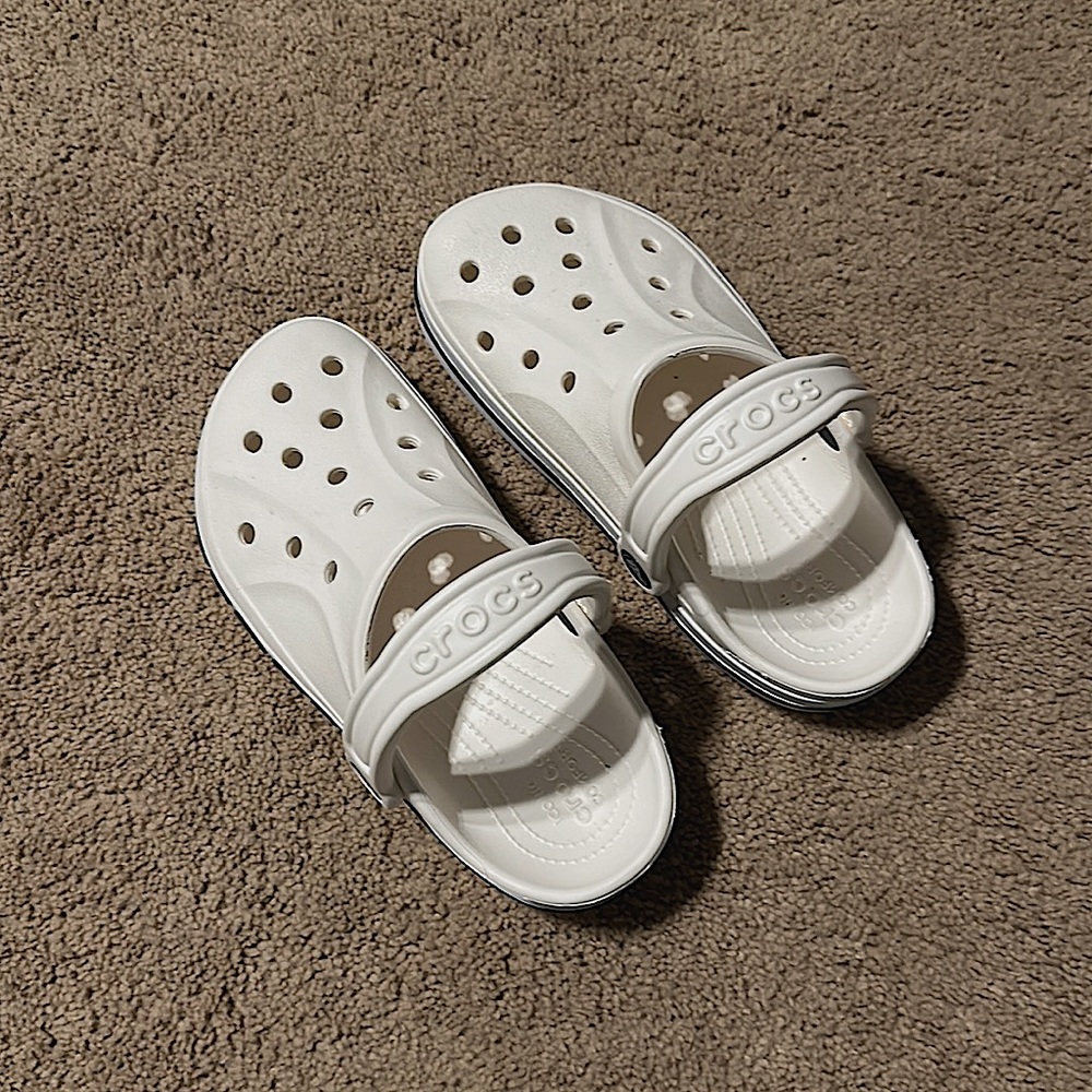 Crocs Blue Crocs logo with stripe.